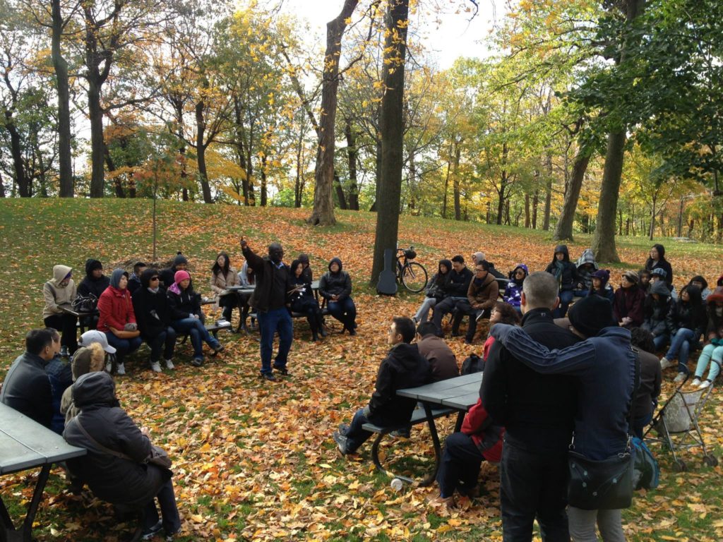 Yaw preaching in the park in Montreal at an outdoor service 
